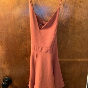 It is a pinkish grey color romper
